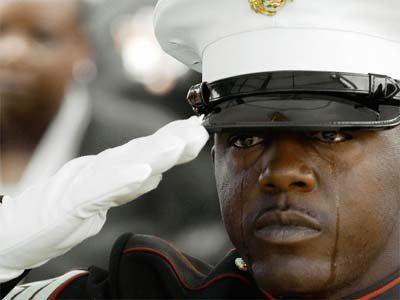 Man in uniform in tears