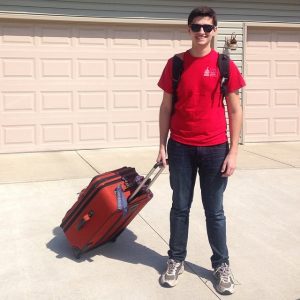 Kid holding a luggage