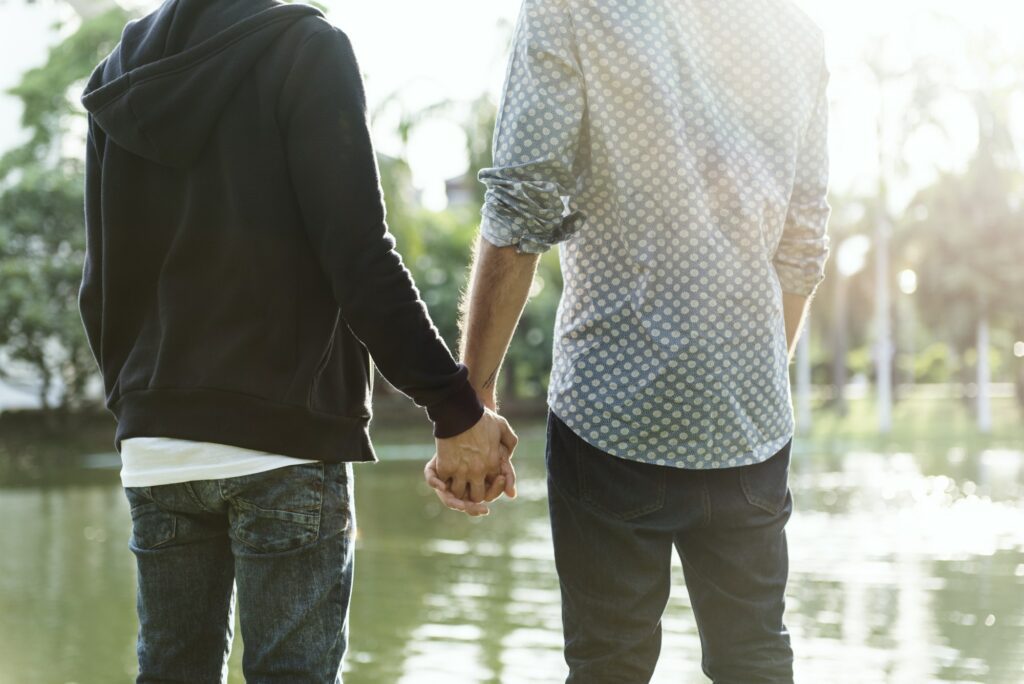 Two guys holding hands