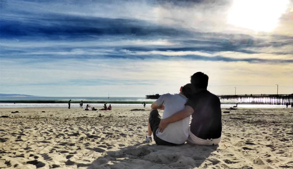 Couple sitting on the beach