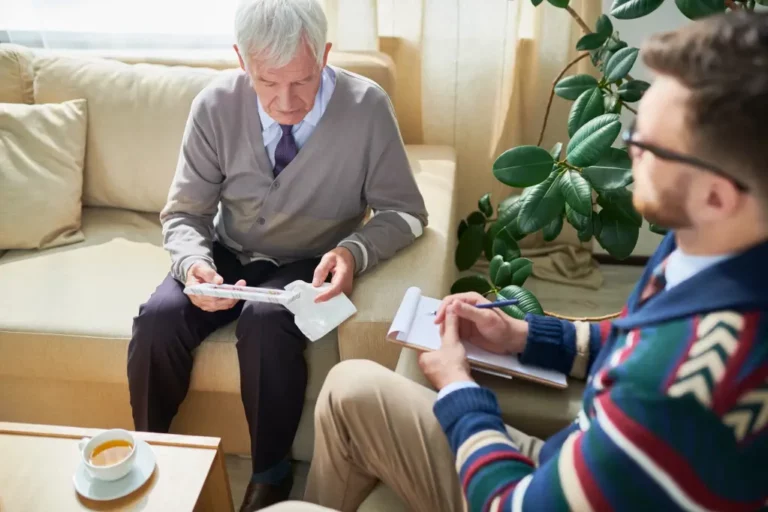 Old man discussing with a therapist